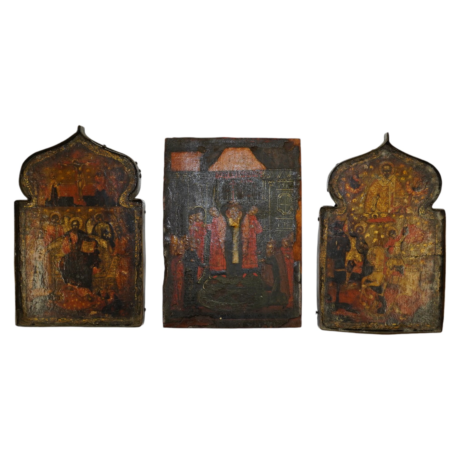 A pair of 17th century or later Russian painted wood icons, and another similar, 13.5 x 10cm. Condition - poor to fair